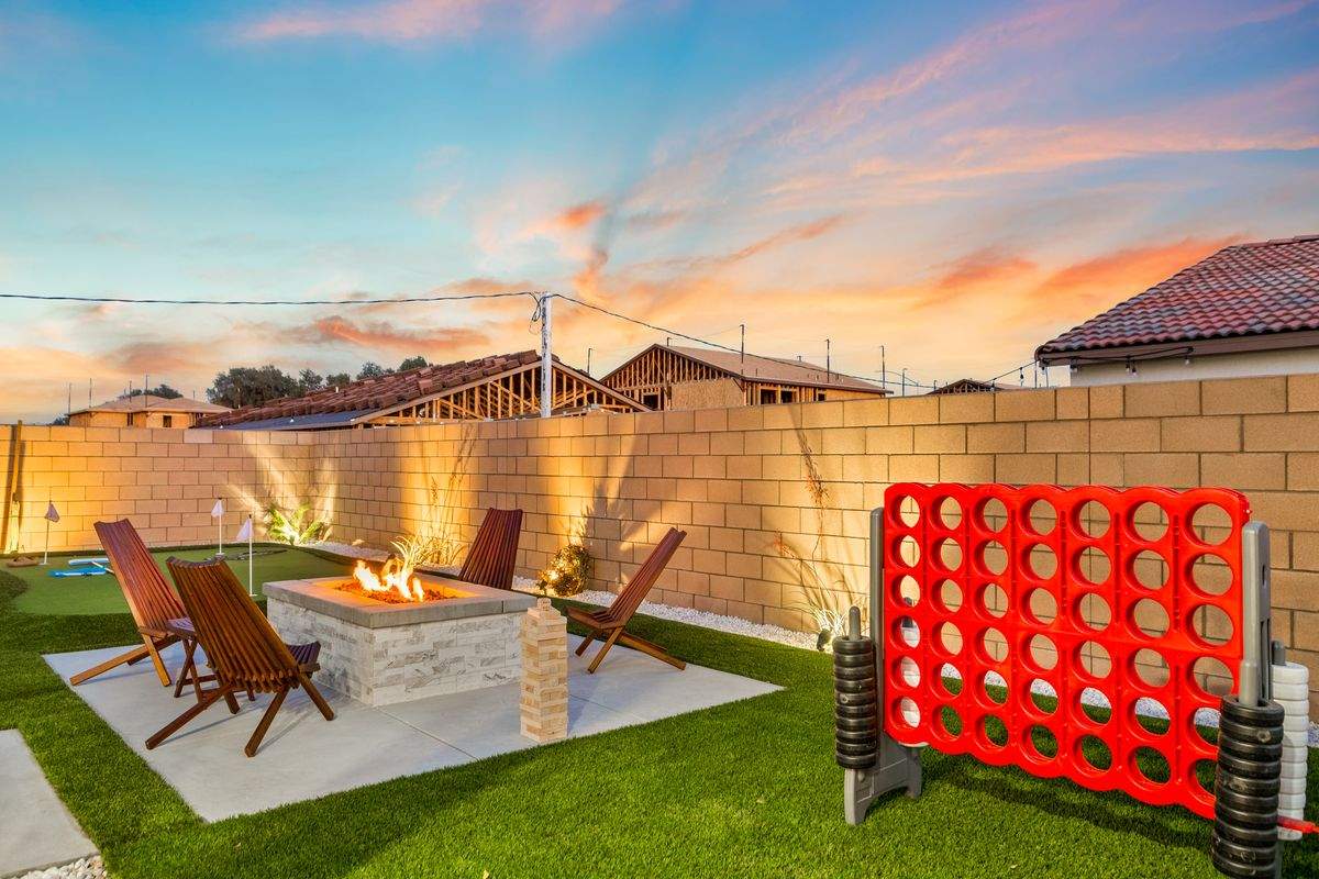 Backyard patio with BBQ and fire pit